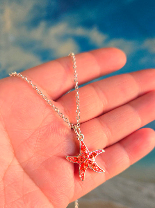 Cadena diseño estrella de mar color anaranjada, decorada con cristales